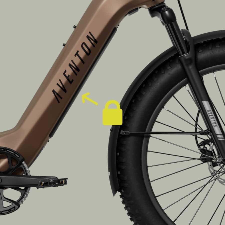 Close-up of the Aventon - Aventure 3 fat tire ebike displays the Aventon brand on the frame, front wheel, and a yellow padlock icon highlighting the frame. Available at Tampa Bay eBikes.