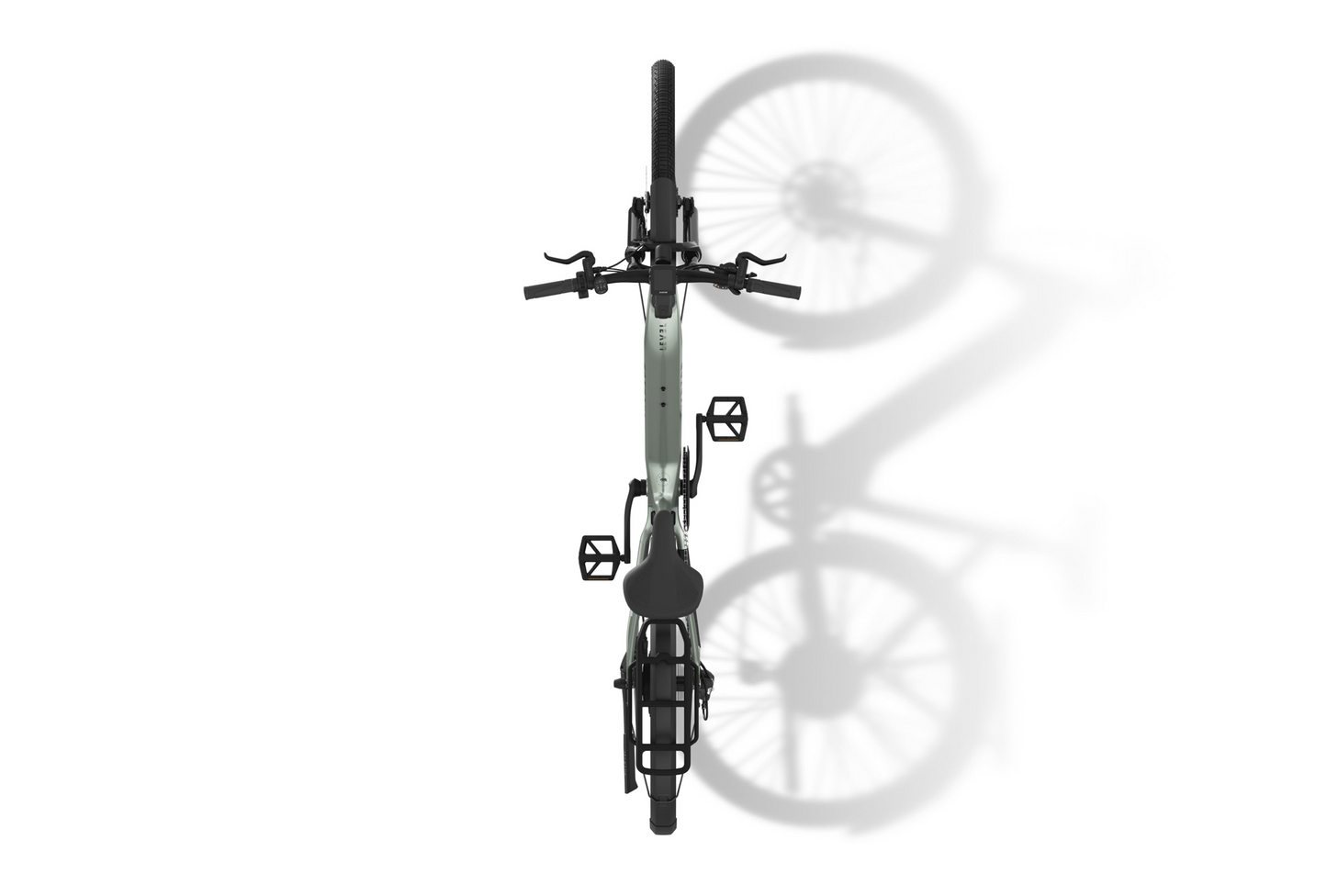 Top view of a folded black Aventon commuter eBike on a white background, casting a shadow to the right, showcasing its compact size and smart design.
