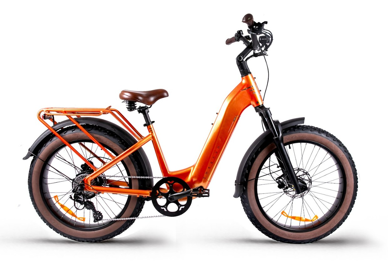 The Magnum - Bliss by Tampa Bay eBikes is an orange electric bike with a step-through frame, wide tires, rear cargo rack, front suspension fork, fenders, and a powerful 500W motor for extended range, shown against a white background.