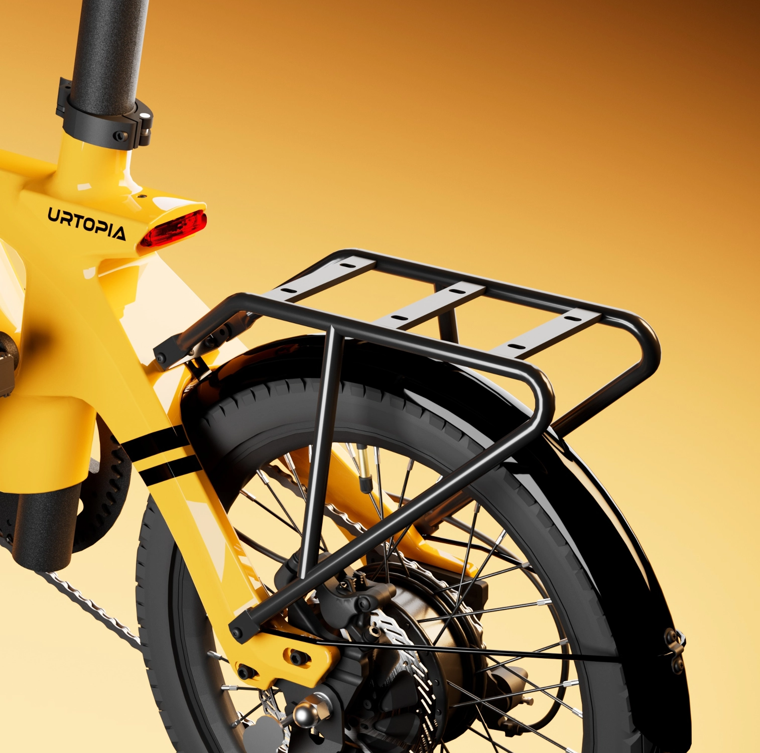 Close-up of the rear wheel and frame of a yellow Urtopia bicycle, showcasing a black Urtopia Rear Rack - Fold 1 and fender, against an orange gradient background.