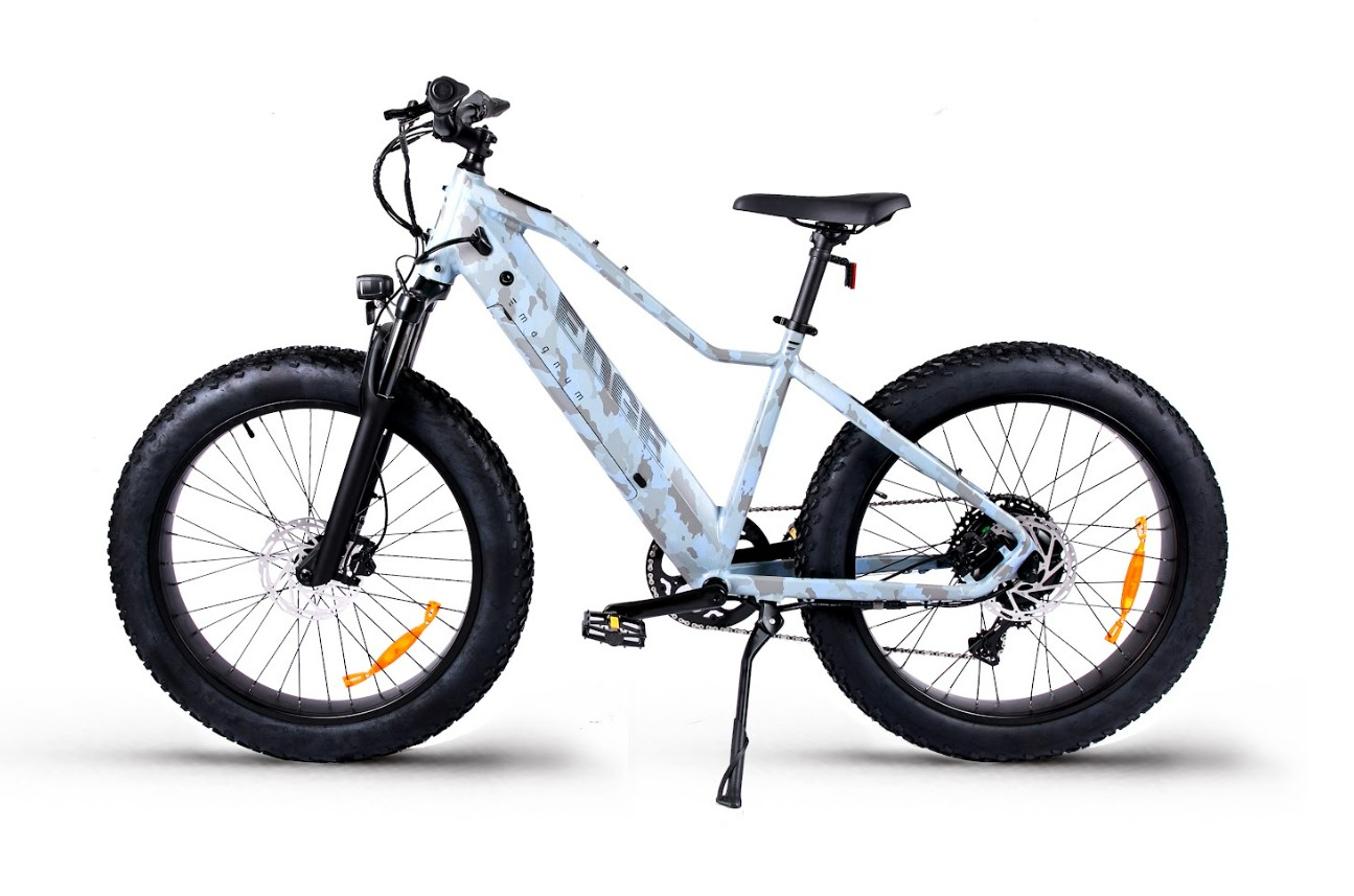 The Magnum - Edge by Tampa Bay eBikes is a light blue fat-tire eBike with a sturdy frame, 750W motor, thick tires, front suspension, and upright handlebars, shown on a white background.