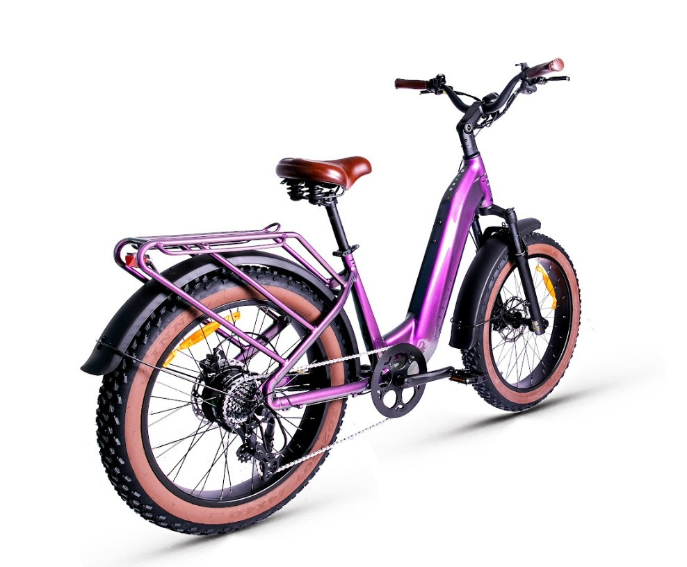 The Magnum - Bliss by Tampa Bay eBikes is a purple electric fat tire bike with a 500W motor, brown saddle, rear rack, and wide knobby tires, shown from a rear side angle on a white background.