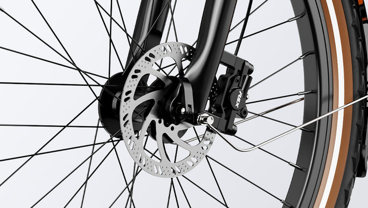 Close-up of a HeyBike- Cityrun's front wheel showcasing the hydraulic front suspension and detailed spokes on a gray background.