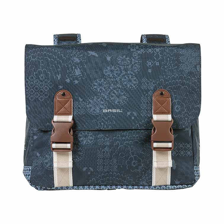 The Basil Boheme Double Pannier Bag by Basil features a blue pattern, brown and beige buckles, floral designs, and the Basil logo on the front flap.