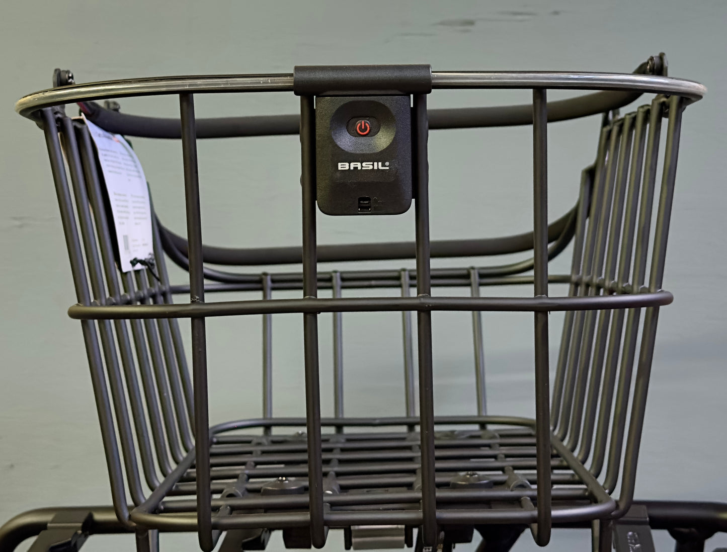 A rear bicycle basket, the Basil Cento MIK by Basil, crafted from weatherproof aluminum with a black finish, is shown against a plain light background.