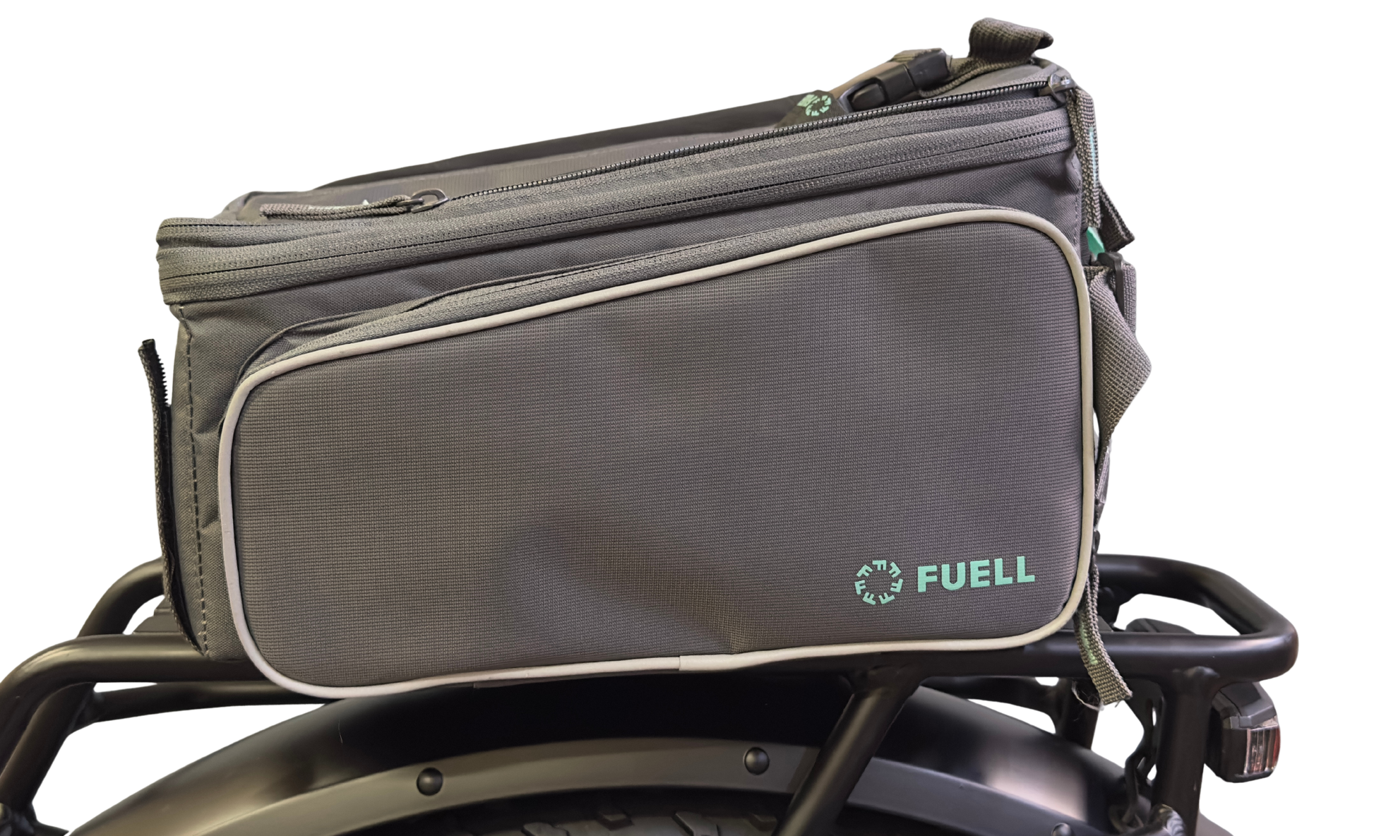 A Basil Sport Design MIK Bag in graphite & mint is attached to a black bike rack, featuring a front zippered pocket, top handle, and MIK adapter system compatibility for secure mounting.