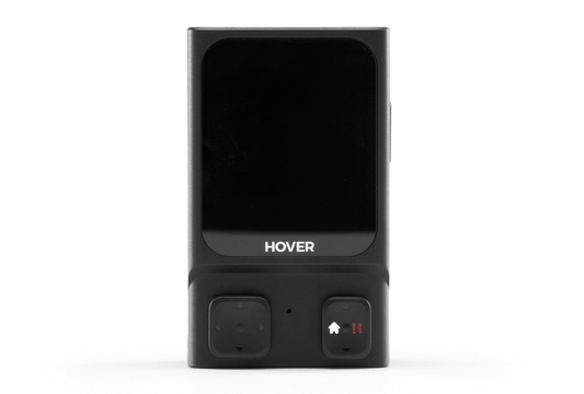 The HOVERAir Beacon, a sleek black device with a small screen and two "Hover" buttons, is designed with intelligent battery technology to extend flight time for your HoverAir X1 Pro & Pro Max.