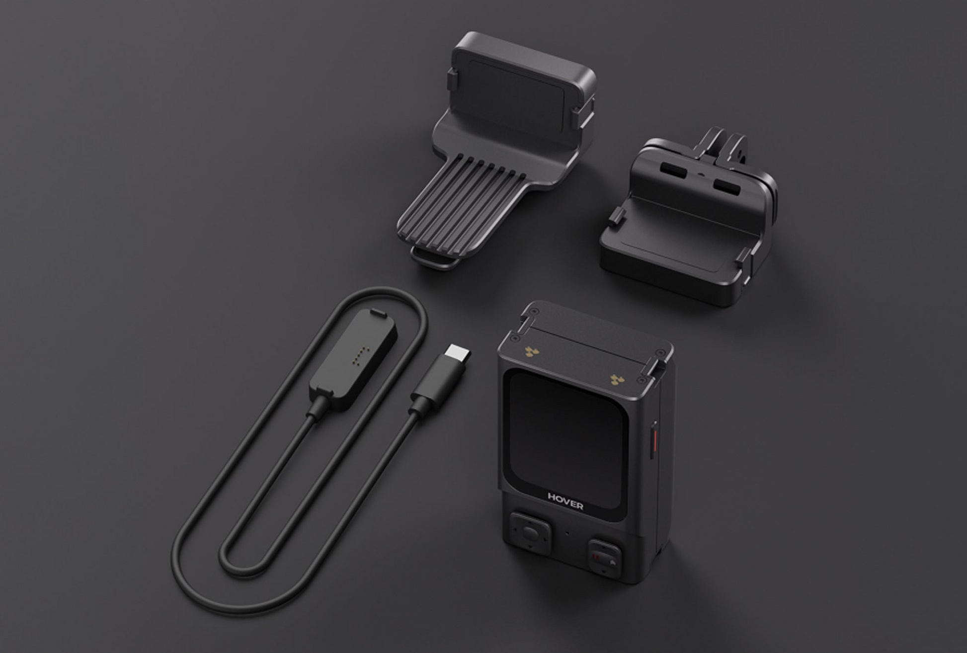 The sleek black HOVERAir Beacon is displayed with three accessories: the Intelligent Battery for Extended Flight Time, a USB-C cable, and two mounts, all set against a dark background.