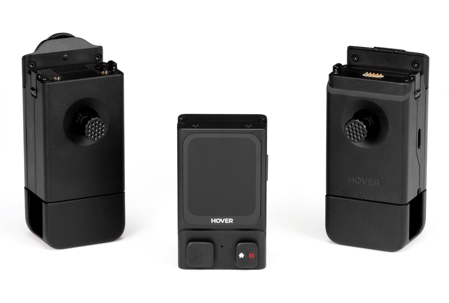 Three HOVERAir black electronic devices, rectangular with buttons and textured knobs, are arranged side by side on a white background, showcasing HOVERLink technology for seamless real-time monitoring.