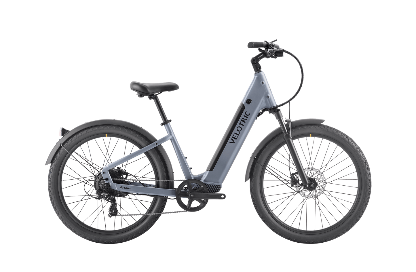 The Velotric - Discover 1 Plus is a modern, gray commuter e-bike with an electric motor, featuring a step-through frame, black saddle, and wide tires. The brand name "Velotric" is visible on the frame, and it boasts the powerful Velopower H50 drive system for an effortless ride.