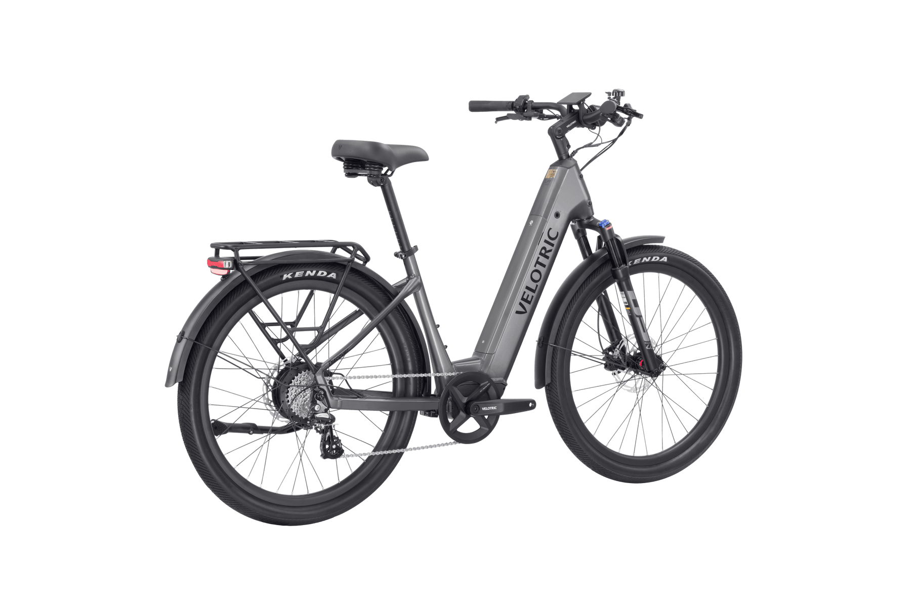 The Velotric - Discover 2, offered by Tampa Bay eBikes, is a gray eBike with a rear cargo rack and large black tires. Featuring advanced eBike engineering, it boasts a front suspension fork, mid-drive motor, and disc brakes for superior performance.
