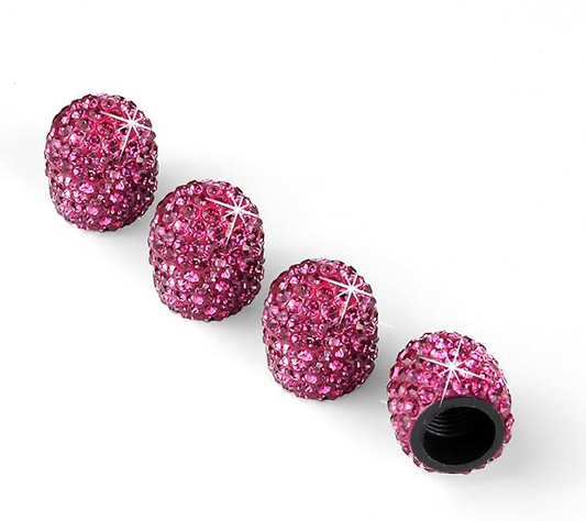 Four EPWR Valve Gems - Pink Topaz valve stem caps are displayed on a white background, one showing its threaded interior. These sparkling Swarovski crystal caps add a stylish accent to your car or bike wheels.