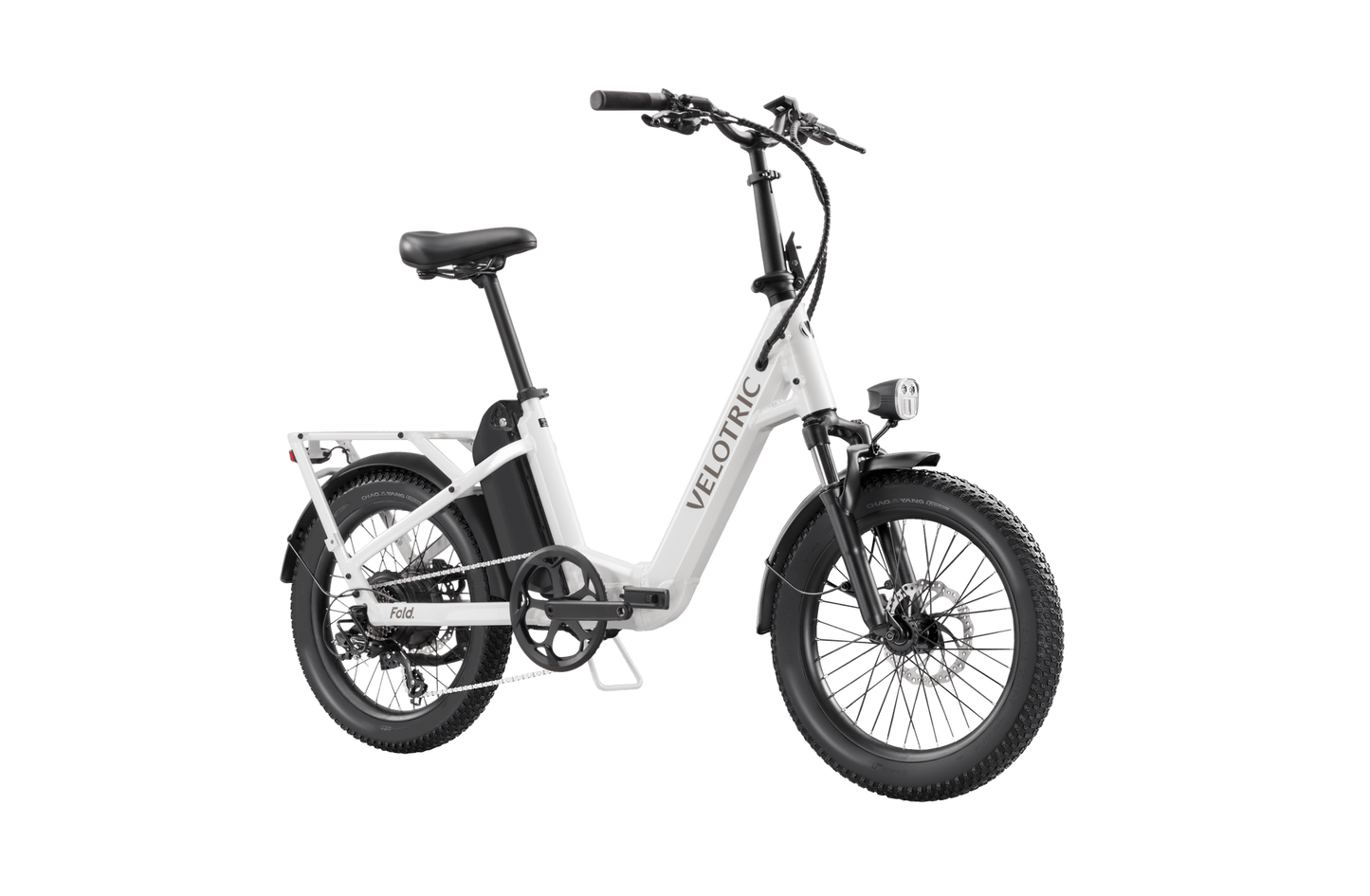 Velotric - Fold 1 electric folding bike with thick tires and a rear cargo rack, set against an isolated black background.