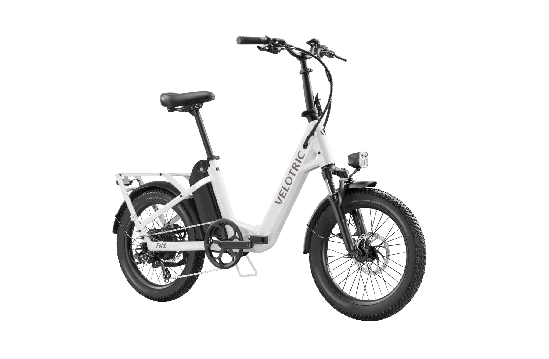 Velotric - Fold 1 electric folding bike with thick tires and a rear cargo rack, set against an isolated black background.