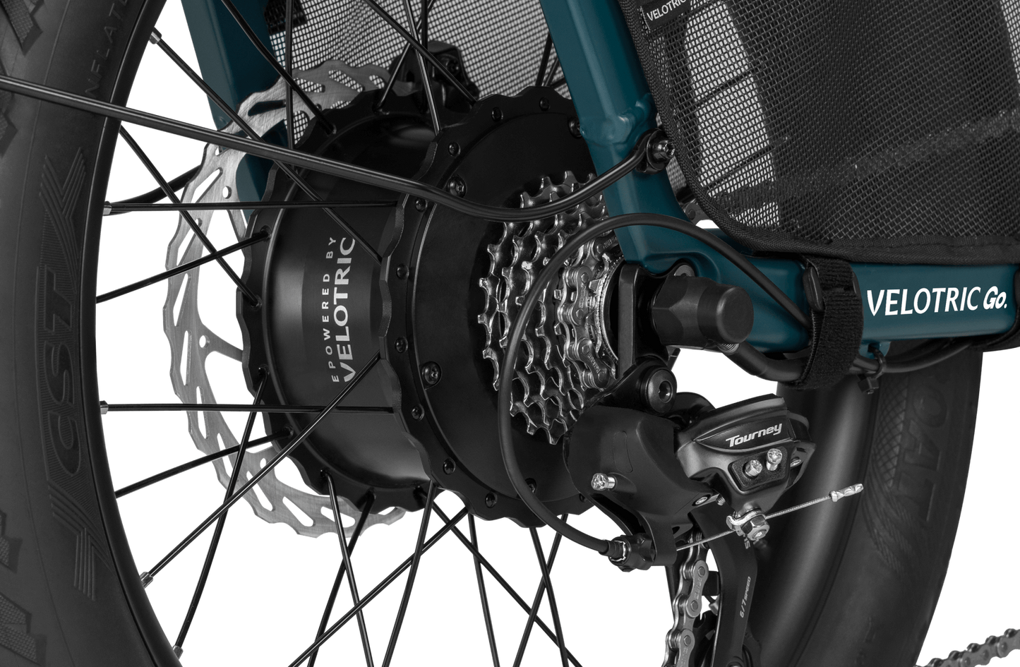 Close-up of a Velotric Forest electric bicycle’s rear wheel, showcasing the hub motor, Shimano Tourney derailleur, and disc brake.