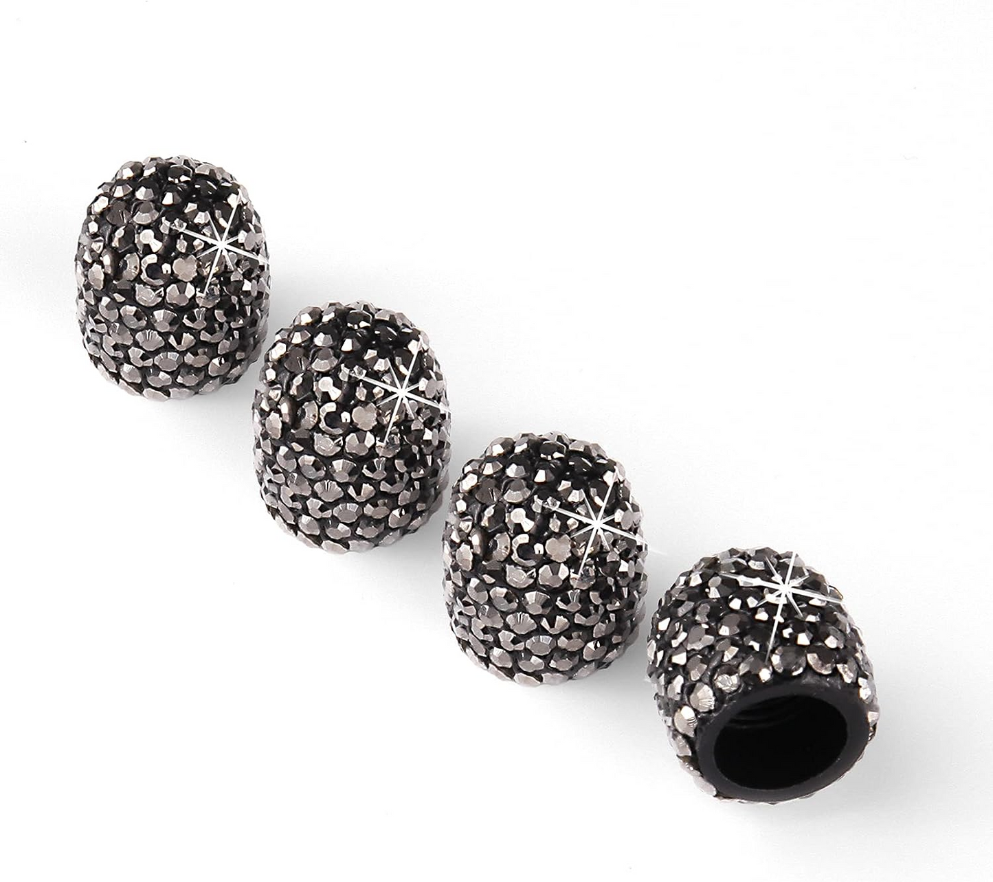 Four EPWR Valve Gems - Graphite, sleek black cylindrical caps embellished with sparkling Swarovski crystals, are arranged on a white background.