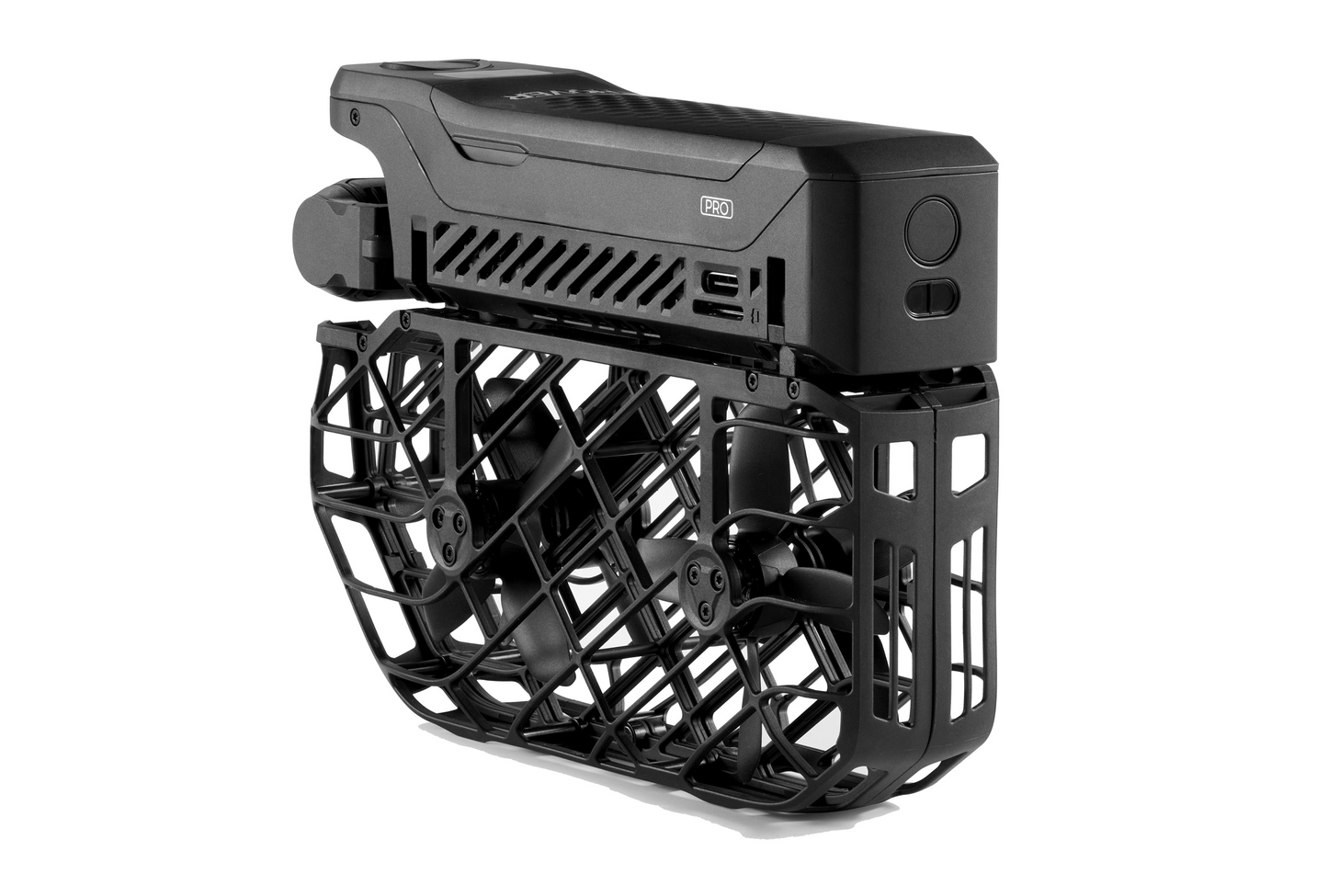 The HOVERAir X1 Pro, an AI-powered black foldable drone by HOVERAir with encased propellers, boasts a sleek and compact design as it rests elegantly on a white background.