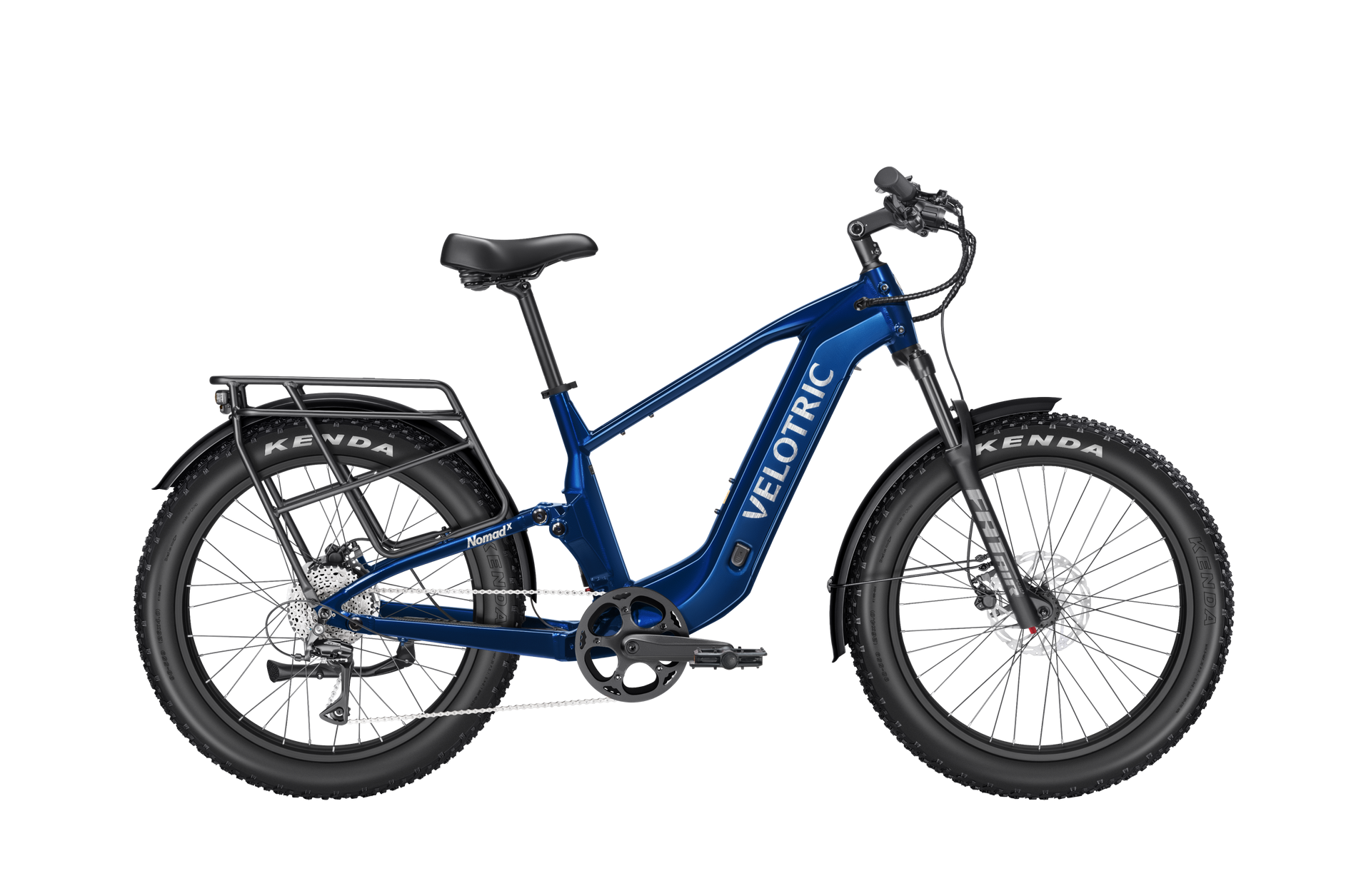 The Velotric Nomad 2X, an all-terrain blue eBike with fat tires, front suspension, rear cargo rack, and disc brakes by Velotric, is shown in profile on a white background.