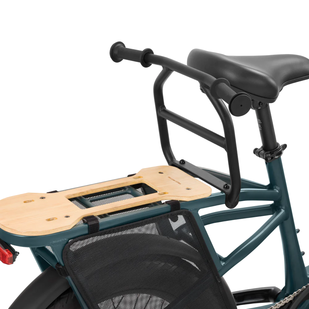 The bike's frame provides stability, while the Velotric Go & Packer handrail sits on the back with a handrail for added support.