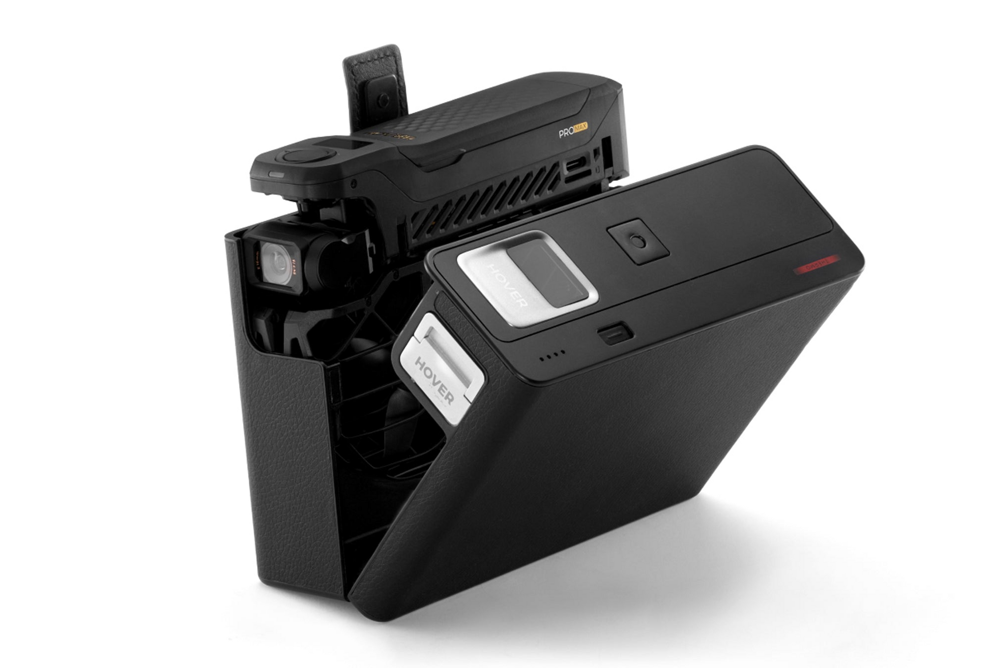 The HOVERAir Power Case by HOVERAir is a black electronic device with a textured surface, visible camera lens, screen, and buttons. Designed for adventurers, it boasts 8K Flying Action Camera prowess and OmniTerrain features. It's angled open to reveal an interior compartment with slots and labels.