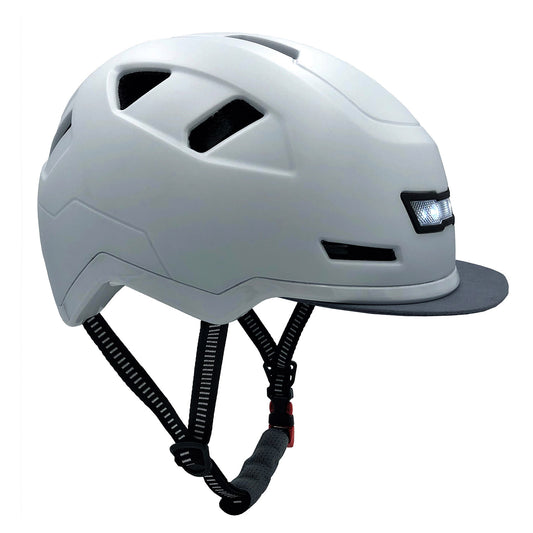 White XNITO e-bike helmet with ventilation holes and an adjustable chin strap.