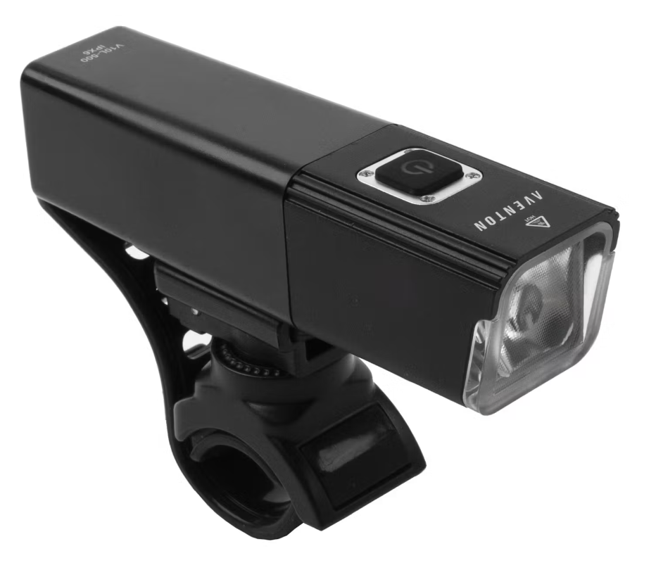 The Tampa Bay eBikes Head Light, a USB rechargeable black rectangular headlight with a power button on top, is securely mounted on a handlebar clamp.