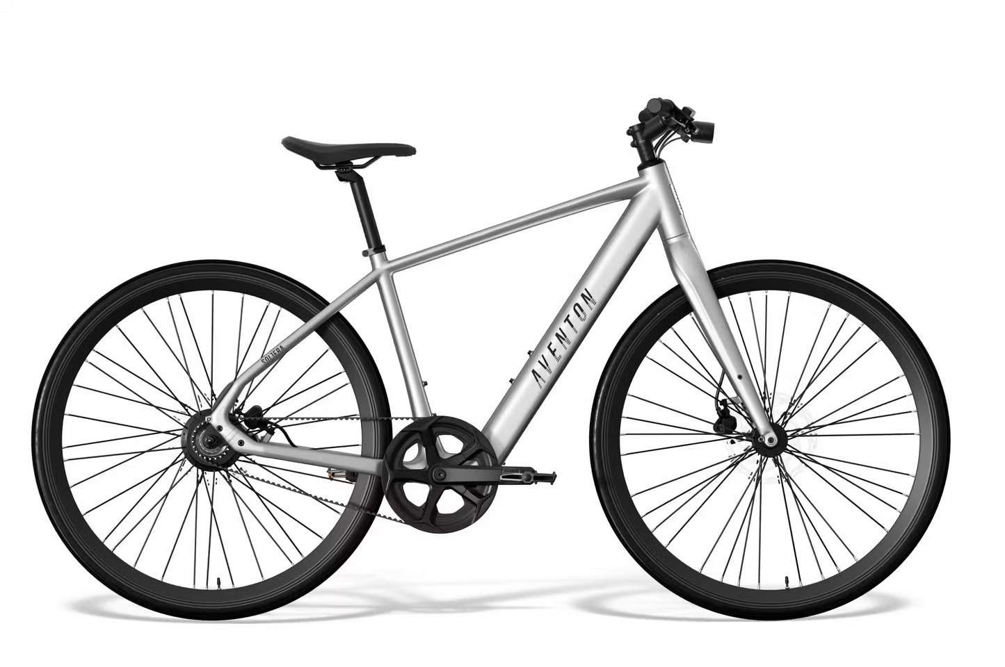 The Aventon Soltera 3 ADV, a silver city ebike with a straight top tube, black saddle and handlebars, is shown from the side on a white background, featuring a smooth and quiet Gates Carbon Belt Drive.