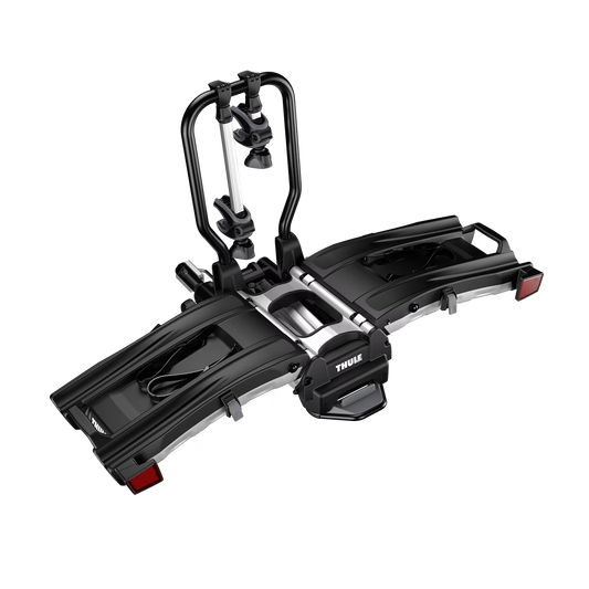 The Thule EasyFold XT Hitch Bike Rack, designed for e-bikes, features adjustable clamps and trays for secure and accessible rear vehicle mounting.