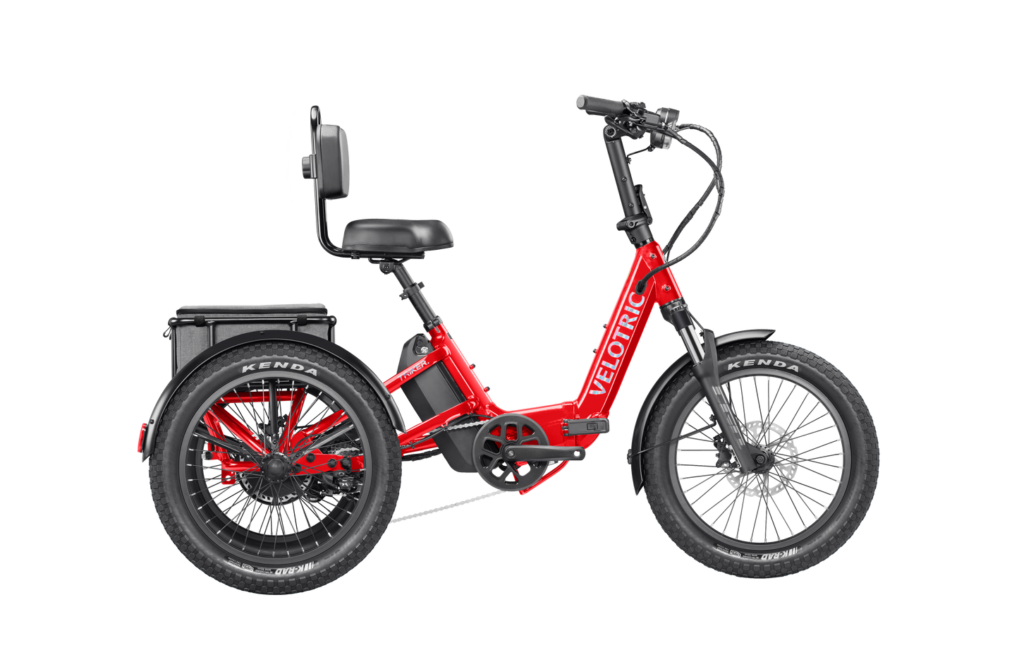 The Velotric Triker is a red electric tricycle featuring two rear wheels, a backrest seat, and a battery behind the seat. The brand name "Velotric" appears on the frame, offering powerful urban eBike performance.