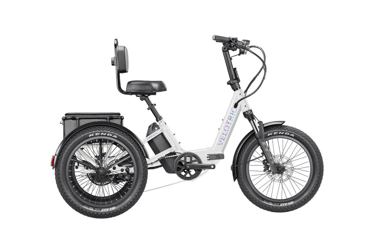 The Velotric Triker is a white three-wheeled urban eBike with large tires, a rear seat backrest, and an over-axle battery, powered by a 1,750W Velotric Breeze motor.