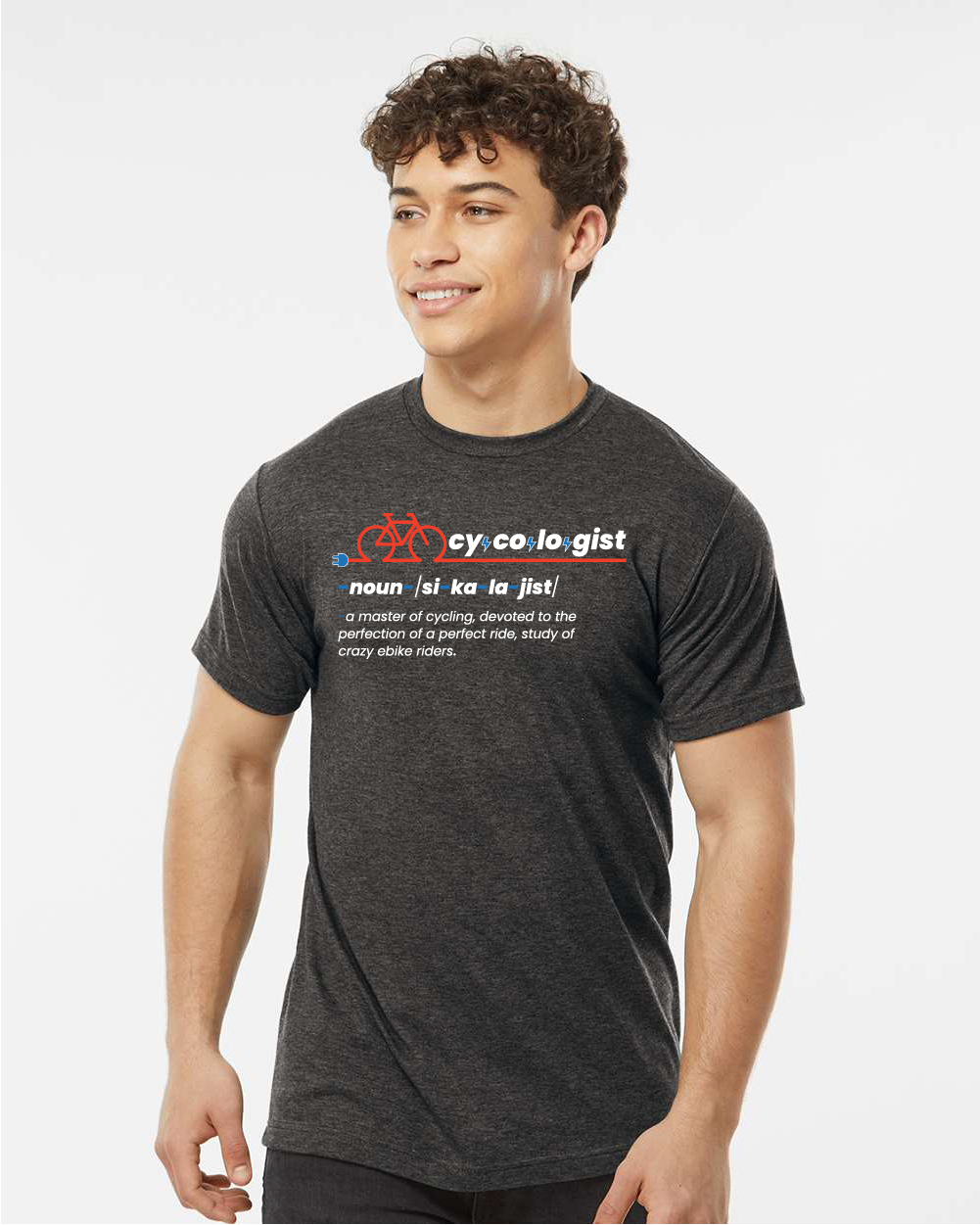 A person wearing a CY-CO-LO-GIST Graphic Tee from Tampa Bay eBikes, which is a dark gray unisex cycling T-shirt featuring a humorous definition of "cyclologist" and a graphic of a bicycle, showcasing their cyclist's passion.