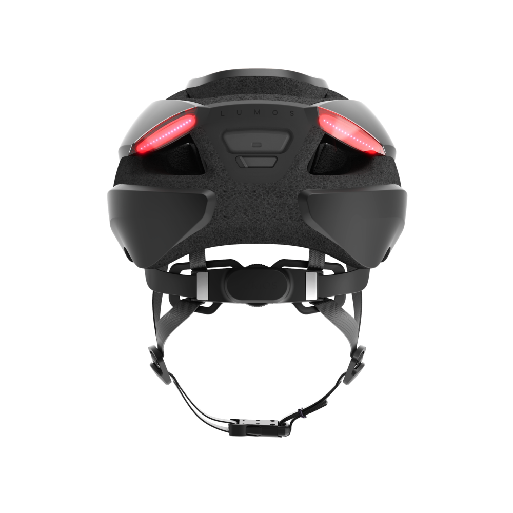 A black Lumos Ultra MIPS Helmet with integrated red lights on the back for enhanced cycling safety.