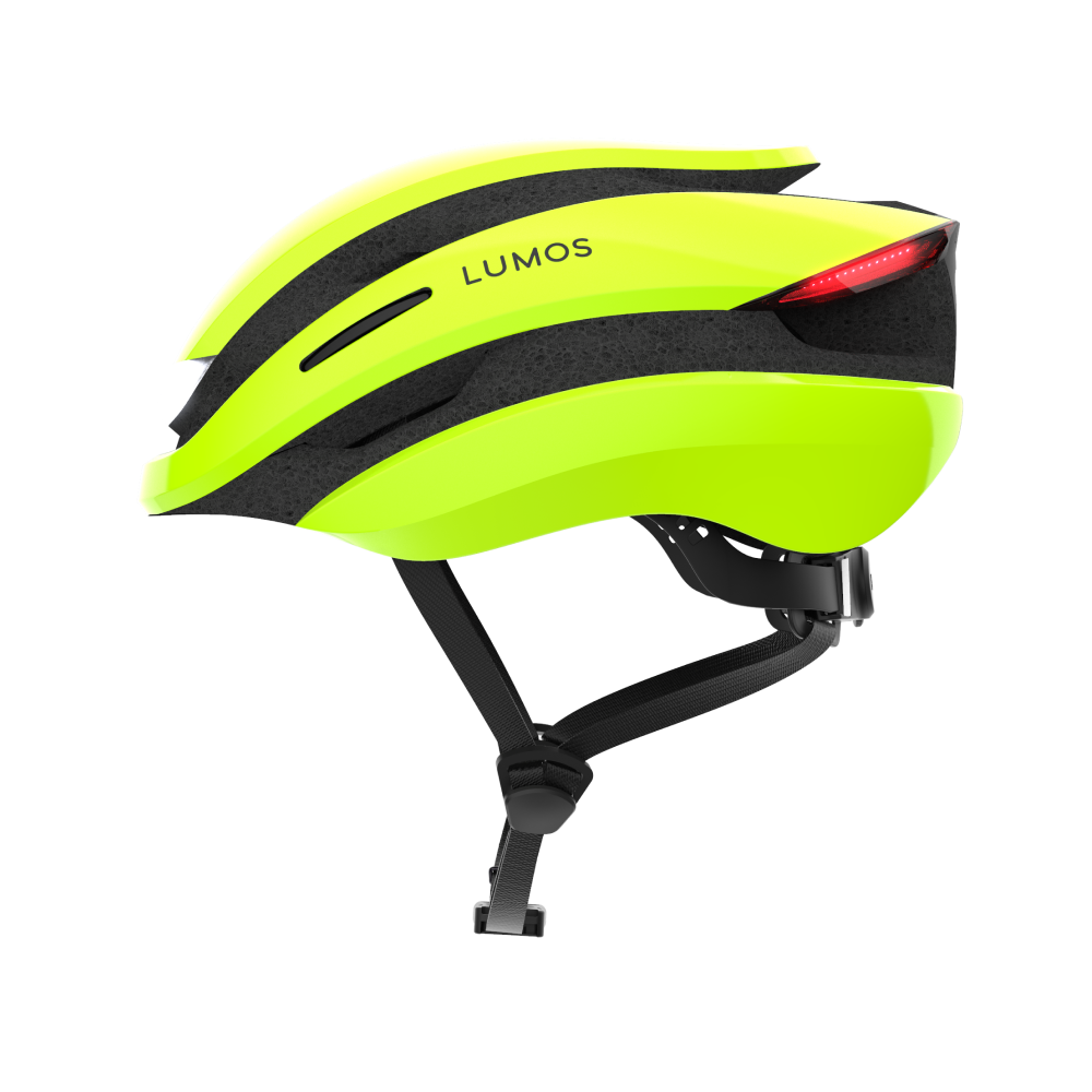 A bright yellow-green Lumos Ultra MIPS helmet with integrated LED lighting for visibility.