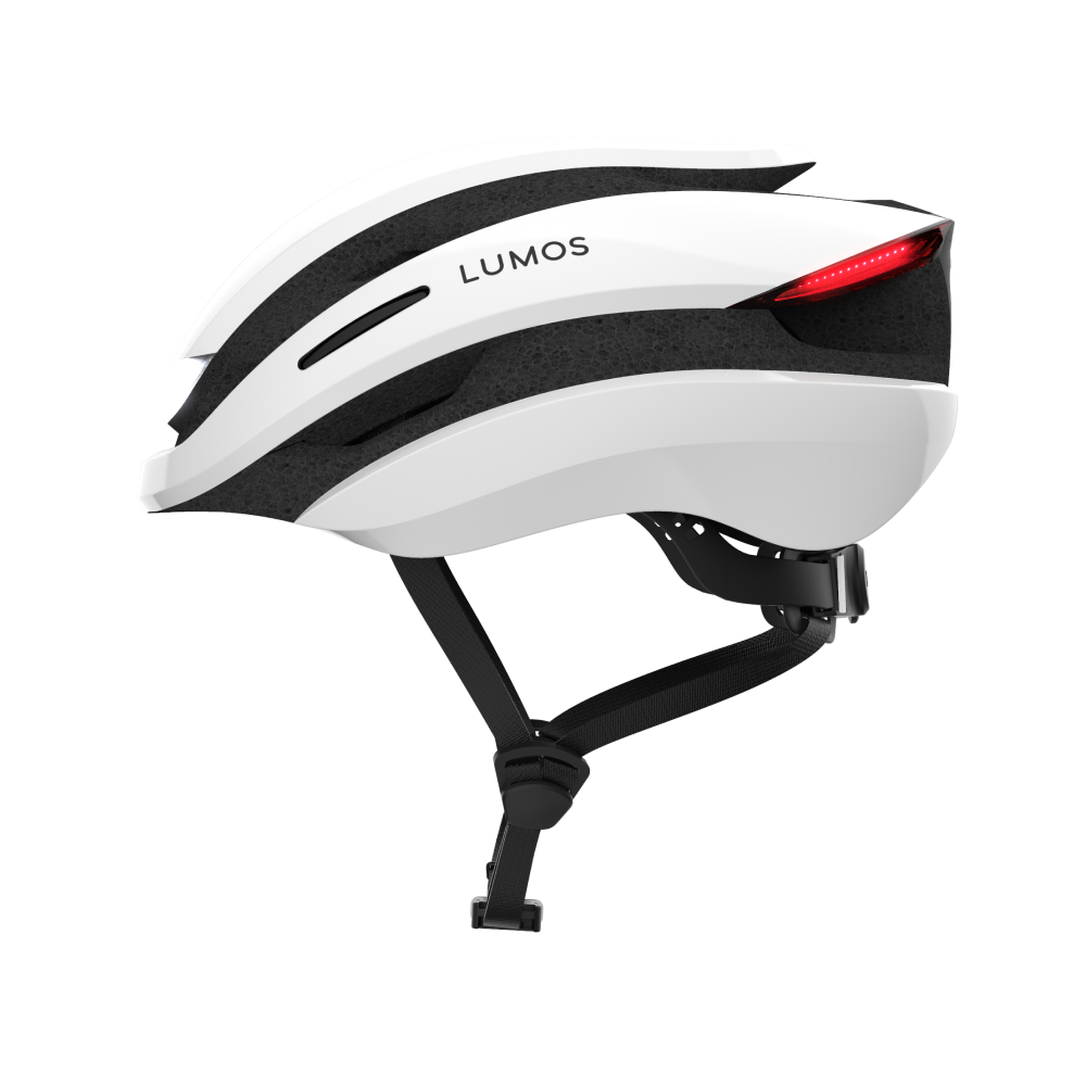 A white Lumos Ultra MIPS helmet with integrated LED lighting and red rear lights.