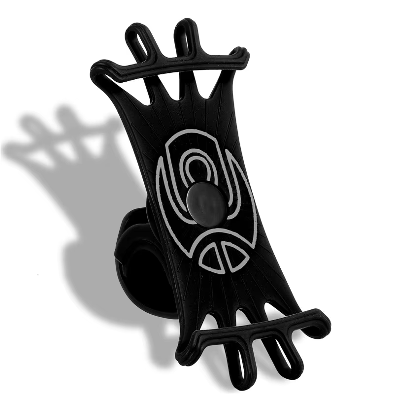 The Cell Phone Holder - Stretch by Tampa Bay eBikes is a black silicone holder with multiple loops, designed for secure device grip. It ensures excellent phone compatibility and stability, with shadows on a white surface enhancing its sleek design.