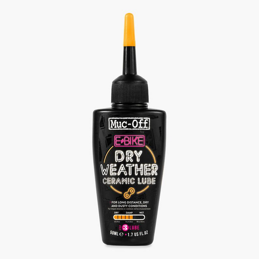 A black bottle of Muc-Off eBike Dry Lube with a pointed nozzle. The label indicates its wax-based formula is suitable for long-distance, dry, and dusty conditions. Contains 50ml (1.7 fl oz).
