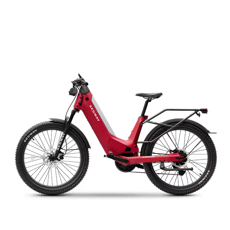 A Segway Xafari Electric Bike by Segway, featuring a 750W motor, thick tires, front suspension fork, rear rack, and upright handlebars, is shown from the side against a white background.