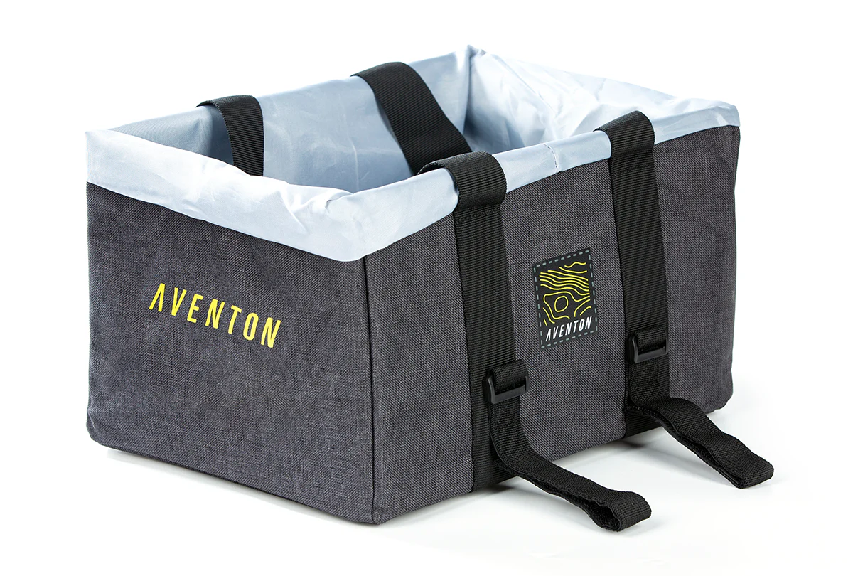 The Aventon Front Bag is a rectangular gray fabric bike basket with black straps, a light gray liner, ample storage, and the Aventon logo in yellow on the side.