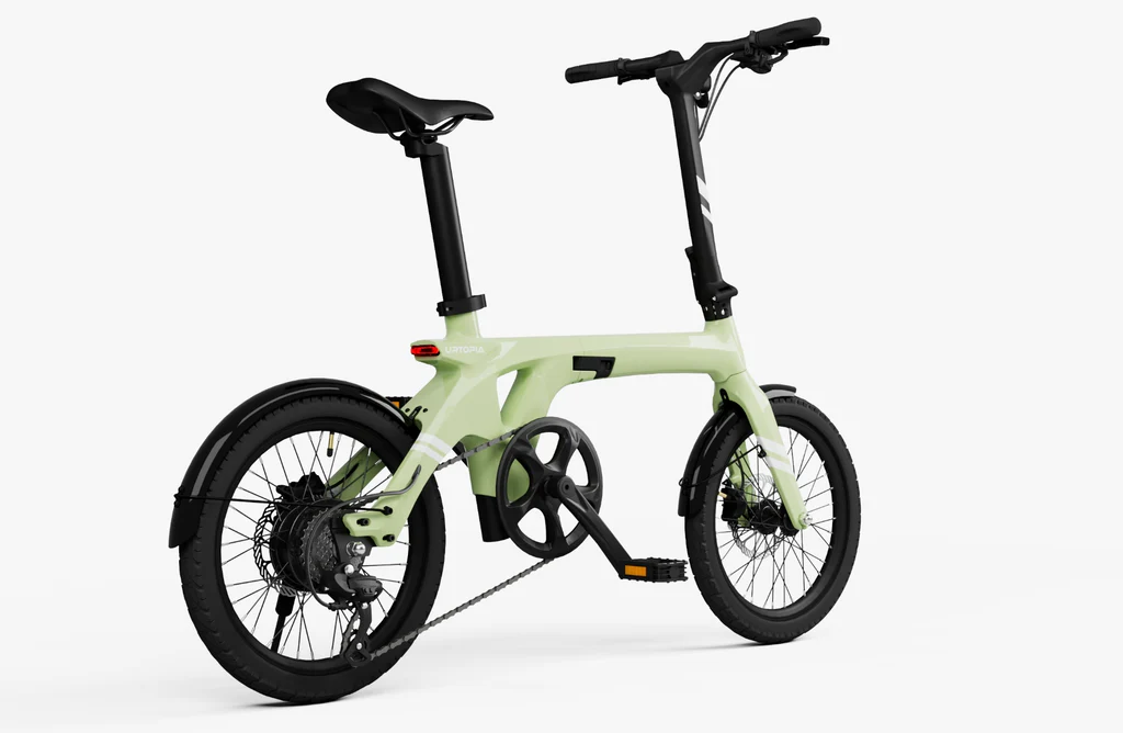 The Urtopia Carbon Fold 1 by Urtopia is a light green folding eBike with a carbon fiber frame, black wheels, pedals, and handlebars, displayed on a white background.