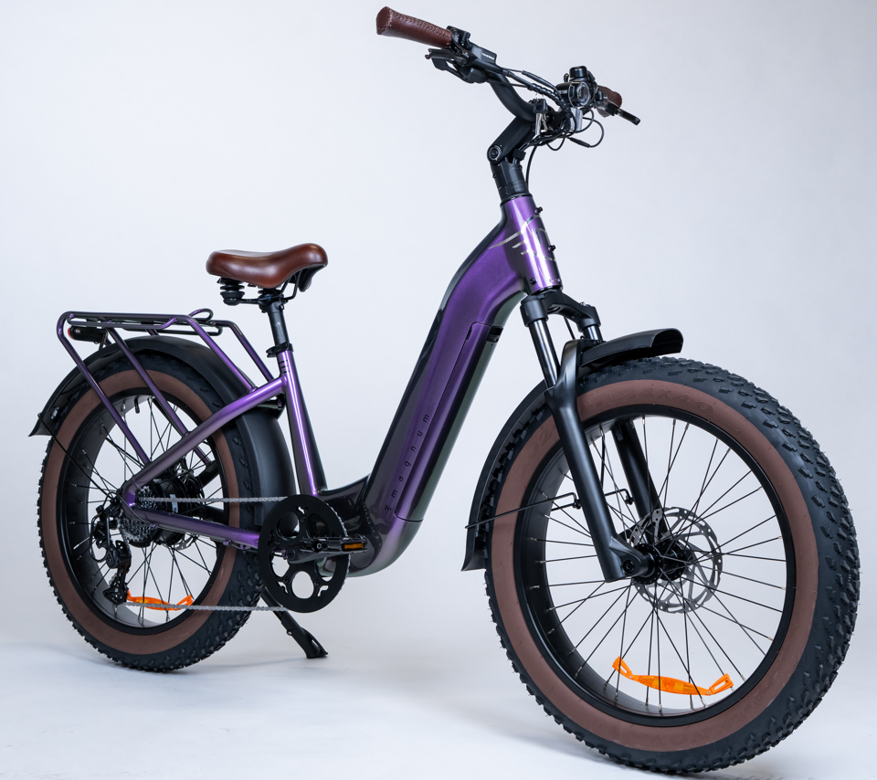 The Magnum - Bliss by Tampa Bay eBikes is a purple electric bike with a powerful motor, wide brown tires, a brown saddle, and a rear cargo rack, shown on a white background.