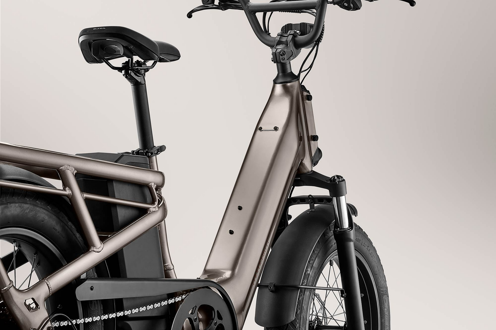Side view of a modern gray Momentum Cito E+ electric bicycle with thick tires and integrated battery, against a light background.