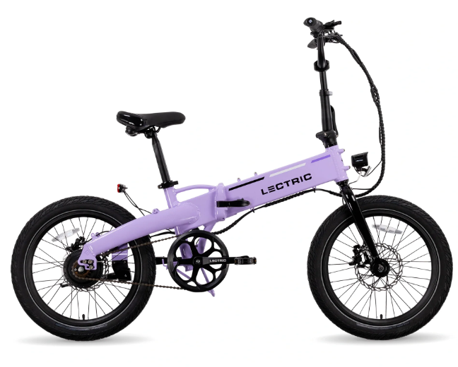 The Lectric - XP Lite 2.0 is a lavender foldable eBike with black handlebars, seat, and tires. Its compact design suits city commutes or leisurely rides, while the sleek frame prominently features the "Lectric" label, highlighting its superior engineering and convenience.