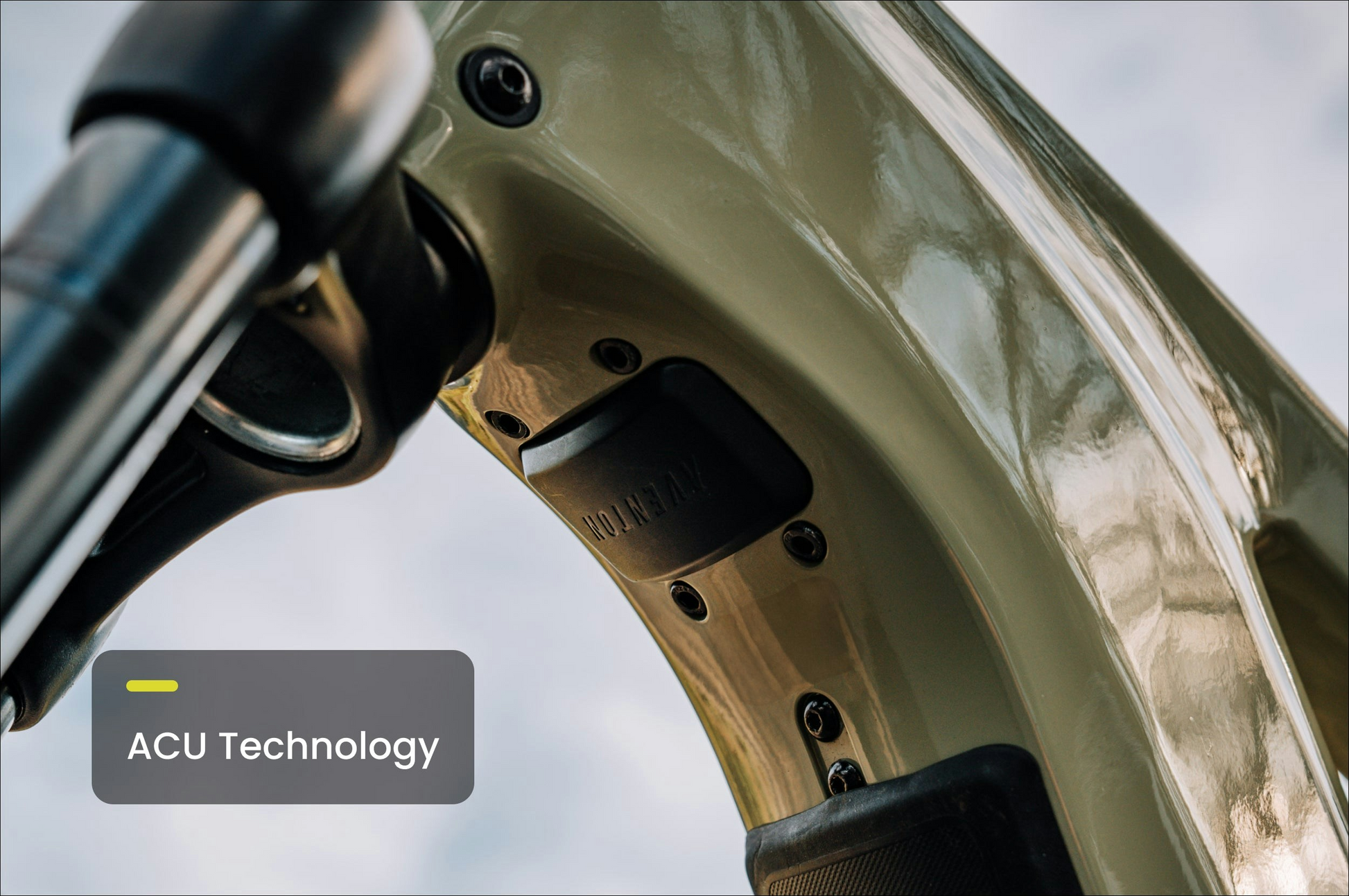 Close-up of a metallic curved structure with a black unit labeled "Aventon" attached; a text box reads "ACU Technology." Ideal for fat tire eBike enthusiasts and Aventon – Aventure 3 riders seeking advanced innovation.