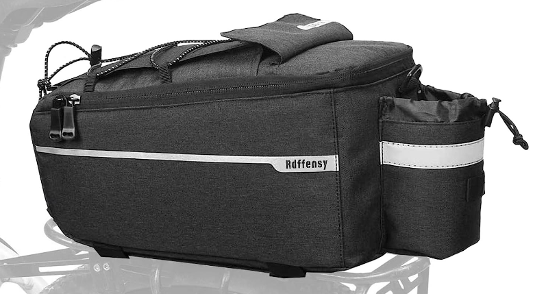 A black rear rack bag with multiple compartments, including a cylindrical side pocket and adjustable straps, labeled "Bag with Cupholder - Rear Rack" by Tampa Bay eBikes.