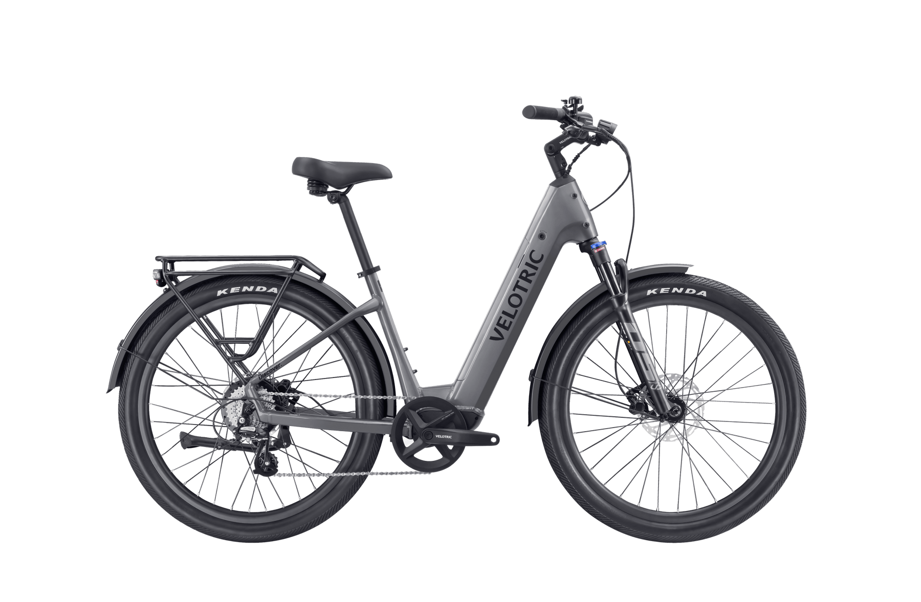 A gray Velotric - Discover 2 with Kenda tires, a step-through frame, black saddle, disc brakes, and a rear cargo rack showcases advanced eBike engineering.