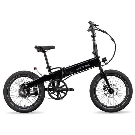 The black Lectric - XP Lite 2.0 eBike with a foldable, compact frame, wire cables, and visible disc brakes at the front and rear is set against a white backdrop, highlighting its powerful performance.