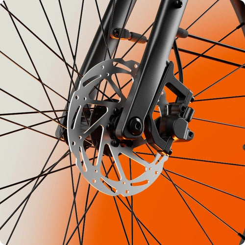 Close-up of the Urtopia - Carbon Classic front wheel with disc brake set against an orange and white gradient, highlighting the bike's sleek, lightweight design.