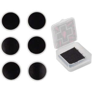 The Muc-Off - Glueless Patch Kit includes six black circular puncture patches and an open plastic case with an additional patch inside, perfect for bicycle inner tubes.