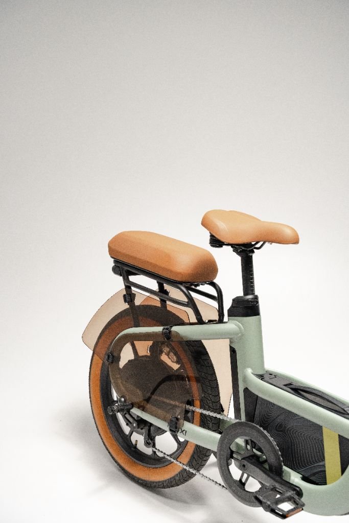 A close-up of the rear half of the Segway Muxi, a modern Segway eBike with a 750W motor, tan seat and tires, set against a plain white background.