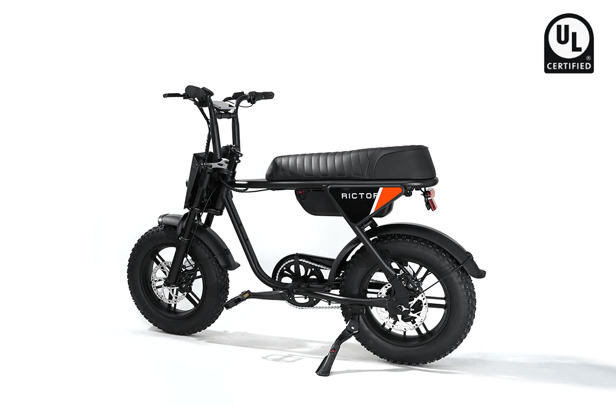 The Rictor - Flexx by Rictor is a black moped-style electric bike featuring thick tires, a long padded seat, and a UL certification logo in the top right corner, shown on a white background.